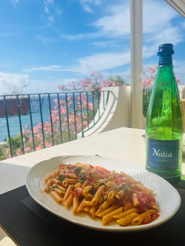 A delicious meal of house made pasta pomodoro with island grown tomatoes and fresh basil in beautiful Ischia, Italy! 